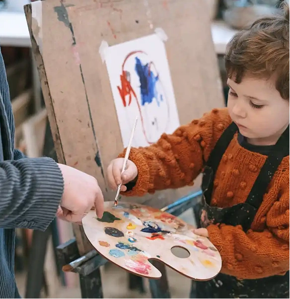 child learning to paint