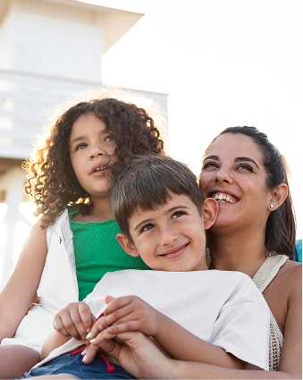 happy woman hugging her children