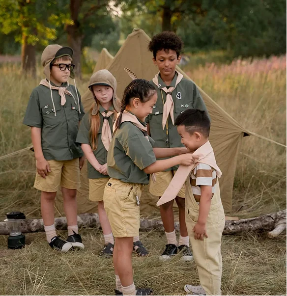 Children welcoming a new member to the camp